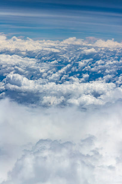 istock Beautiful view from window of plane flying over clouds. Natural panorama with clouds. White clouds moving above the ground. 1090240334