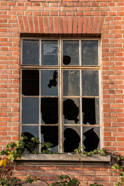 istock Old destroyed brick house ruin with broken windows 1090242150