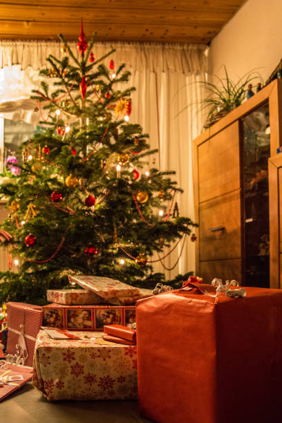 istock Decorated Christmas tree with Christmas tree balls, candlelight and gifts 1090245526