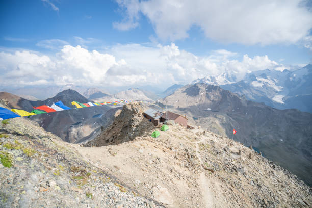 istock Himalayan flags on mountain summit in the Swiss Alps; Bernina mountain range ; 3262 m 1090247216