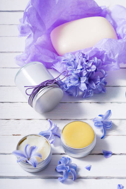 istock Lip balm, moisturizer, soap, white wooden 1090247574