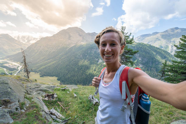 istock Hiker female on mountain trail taking selfie 1090253552