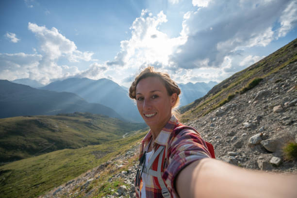 istock Hiker female on mountain trail taking selfie 1090253986