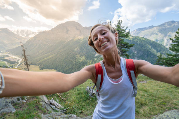 istock Hiker female on mountain trail taking selfie 1090255618