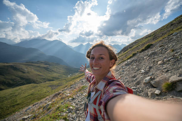 istock Hiker female on mountain trail taking selfie 1090255992