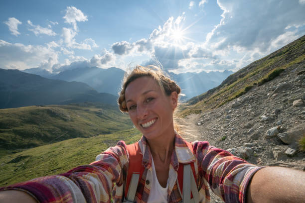 istock Hiker female on mountain trail taking selfie 1090256004