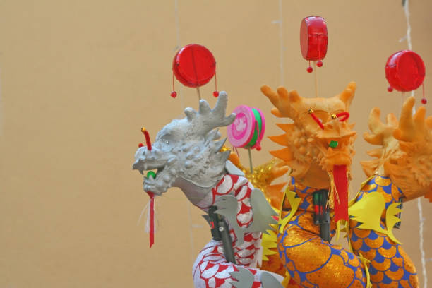 istock Colorful chinese dragon toys on wall background ,( pong-paeng ) 1090258148