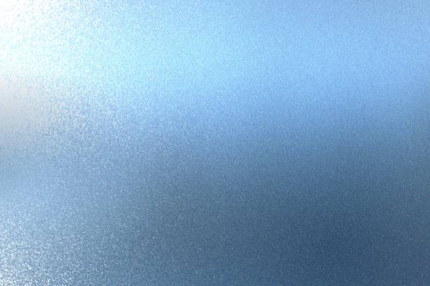 Texture of reflection on rough blue metallic wall, abstract background