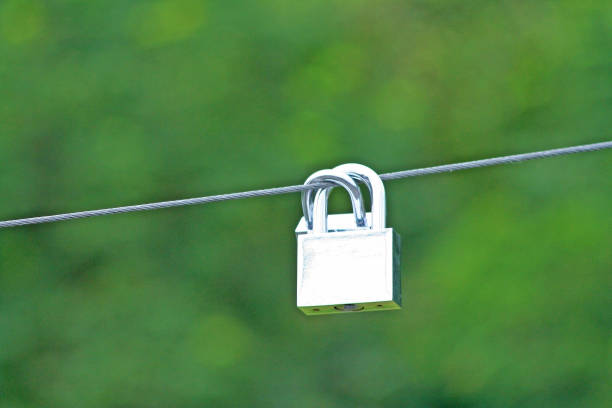 istock Lovers locks and  doll hanging on the new bridge 1090258754