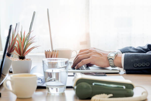 istock Shot of businessman hand using laptop while sitting at workplace. 1090265052