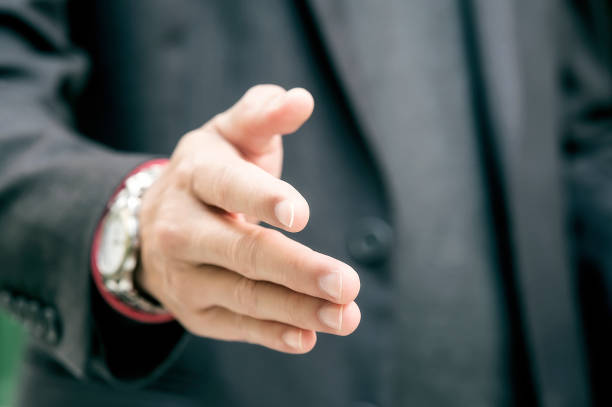 istock Closeup businessmen shaking hands. 1090265668