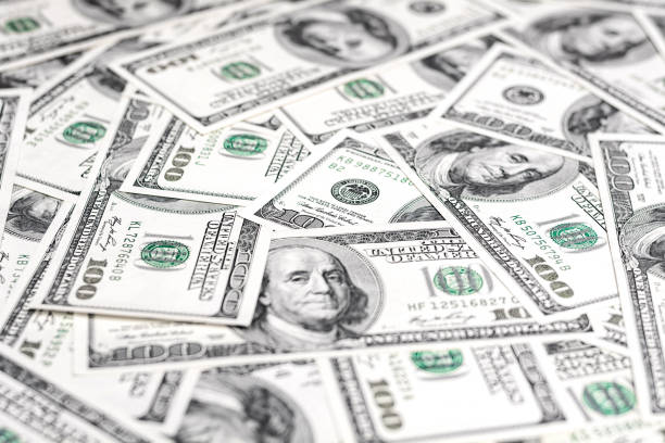 istock One hundred dollar bills. Money paper texture. 1090269086