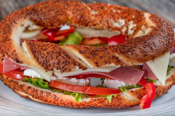 istock Turkish Bagel Simit Sandwich with cheese, tomato and cucumber. 1090269116