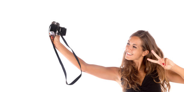 pretty happy girl taking a selfie with camera - photographer enjoyment elegance old fashioned imagens e fotografias de stock