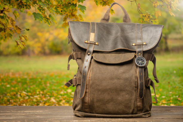 istock Vintage backpack on a natural autumn warm background 1090273706