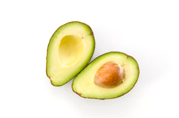 istock Ripe organic avocados half with seed on white background. 1090286832