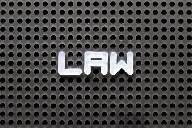 istock Black color pegboard with white letter in word law 1090293120
