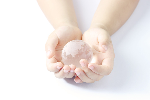 Children's hands and the earth
