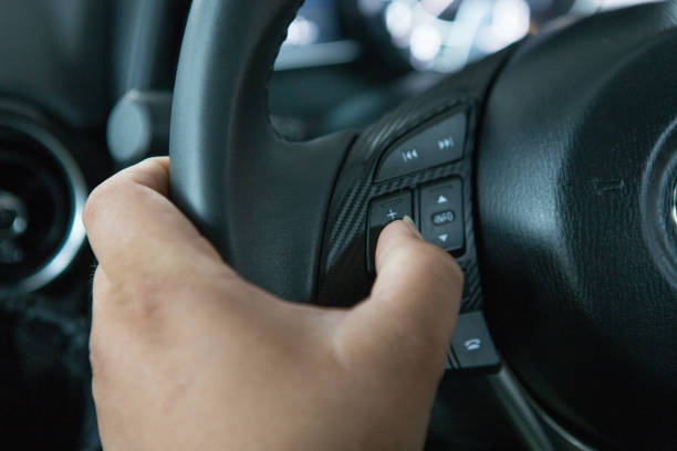 istock Men's hand holding the steering wheel 1090298020
