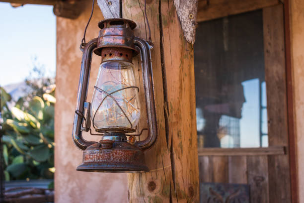 istock Antique rusty lantern hanging outdoors 1090304982