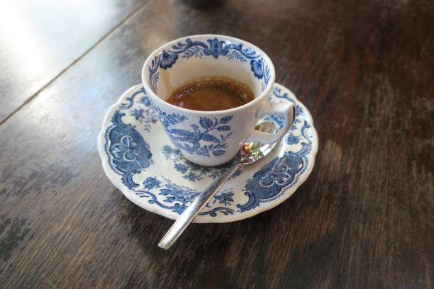 istock hot espresso in vintage style cup on wood table top 1090309796