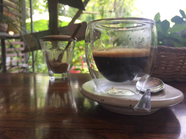 istock hot espresso in the morning on wood table top 1090312144
