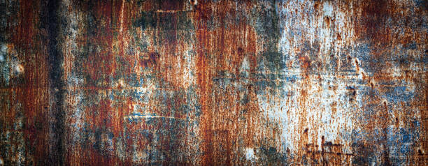 Rusty metal wall, old sheet of iron covered with rust with multi-colored paint rusty metal texture painted in different colors, colored iron wall rust texture stock pictures, royalty-free photos & images