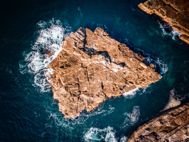 Coastal sea rocks aerial top down views Avoca beach sea rocks abstract.  Aerial image showing the shapes of rocks at Avoca Beach, Australia avoca beach photos stock pictures, royalty-free photos & images