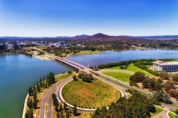 D CAN bridge 2 CBD 2 N Commonwealth avenue and bridge over Burley Griffin lake in Canberra between city CBD and federal government capital hill triangle area with local streets, roads, parks and buildings. canberra photos stock pictures, royalty-free photos & images