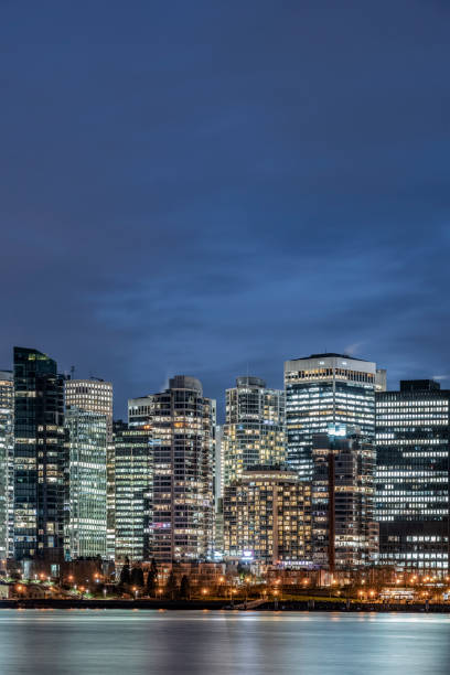 istock illuminated buildings by sea 1090341170