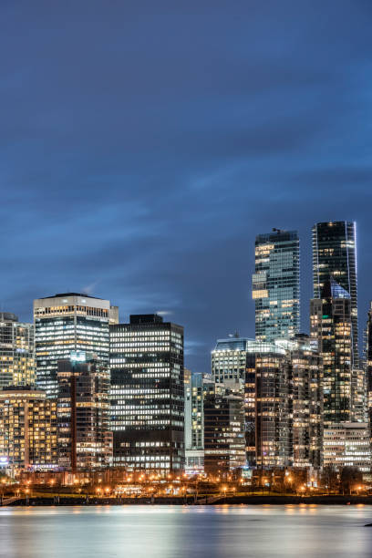 istock illuminated buildings by sea 1090342300
