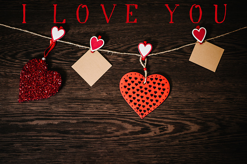 Text I Love You Two Blank Of Craft Paper With Six Red Heart Hanging On Rope On Brown Wooden Background With Space Place For Text Concept Of St Valentines Day Womens Day Text I Love You Two Blank Of Craft Paper With Six Red Heart Hanging On Rope On Brown Wooden Background With Space Place For Text Concept Of St Valentines Day Womens Day