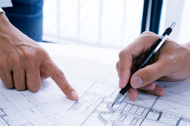 istock Architecture drawing on architectural project business architecture building construction and people concept. 1090351496