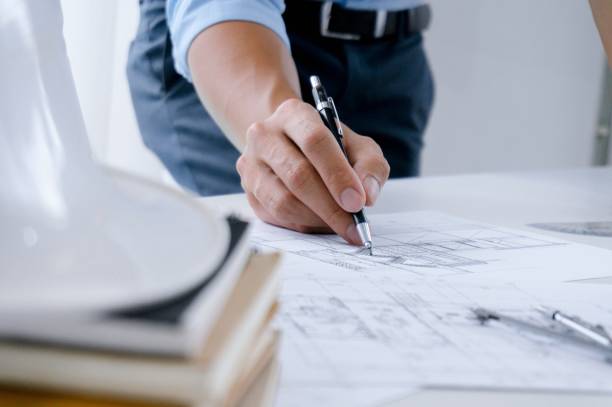 istock Colleagues interior designer Corporate Achievement Planning Design on blueprint Teamwork Concept with compasses. 1090351518