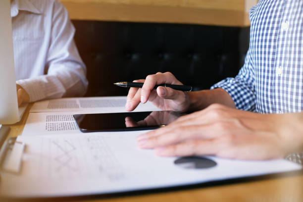 istock Man student writes information from portable tablet while prepare for lectures in University campus 1090351522
