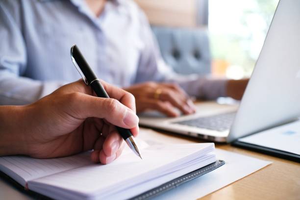 istock Man student writes information from portable tablet while prepare for lectures in University campus. 1090351544