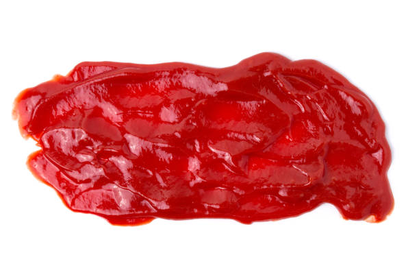 istock red tasty ketchup splashes isolated on white background 1090351758
