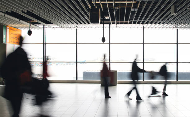 istock Airport passengers crowd walking blurred people 1090353394
