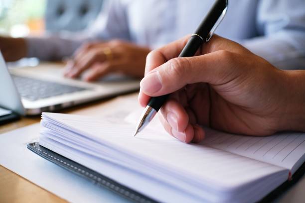 istock Man student writes information from portable tablet while prepare for lectures in University campus. 1090355738