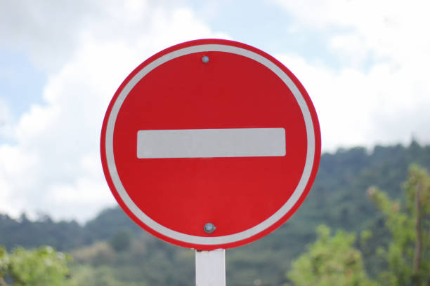 istock No parking area sign with blur background 1090357654