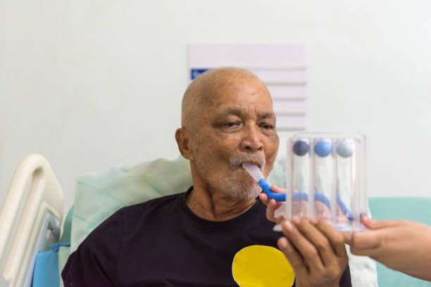 Patient use Incentive Spirometer in hospital stock photo