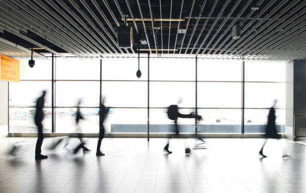 istock Airport passengers crowd walking blurred people 1090360206