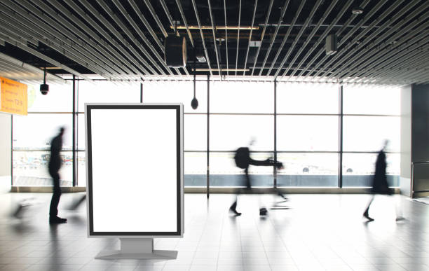 istock Airport passengers crowd walking blurred people billboard advertisement 1090360276