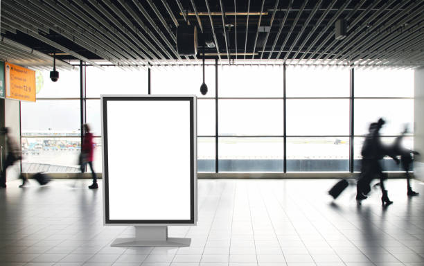 istock Airport passengers crowd walking blurred people billboard advertisement 1090363358