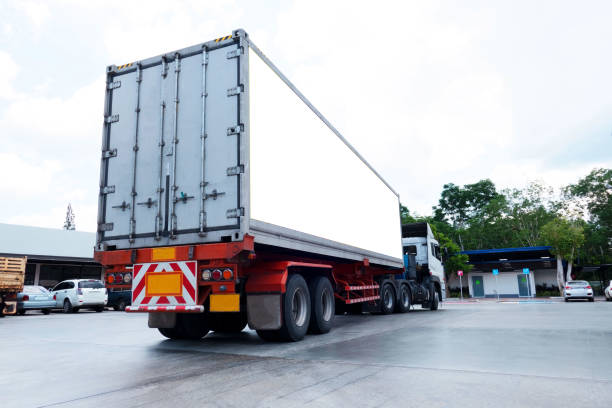 istock container trucks Logistic by Cargo truck on the road .empty white billboard .Blank space for text and images 1090367992