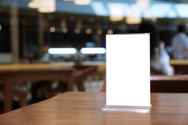 istock Menu frame standing on wood table in Bar restaurant cafe. space for text marketing promotion. 1090369618