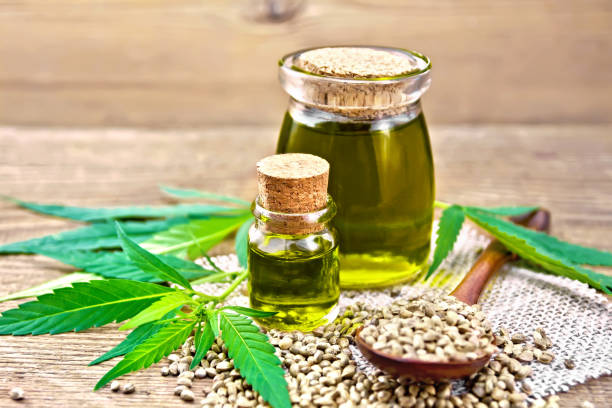 istock Oil hemp in two jars on board 1090370102