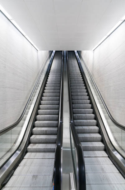 istock vertical view of a long an empty escalator in a train station 1090374584