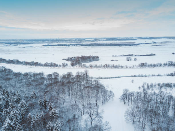 istock Aerial winter forest view. Drone landscape, fly above river. White trees with snow, beautiful wallpaper background. High modern photography. 1090374714