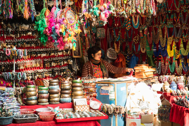 Kathmandu, Nepal - December 6, 2018: A woman selling Nepali goods at Thamel market.